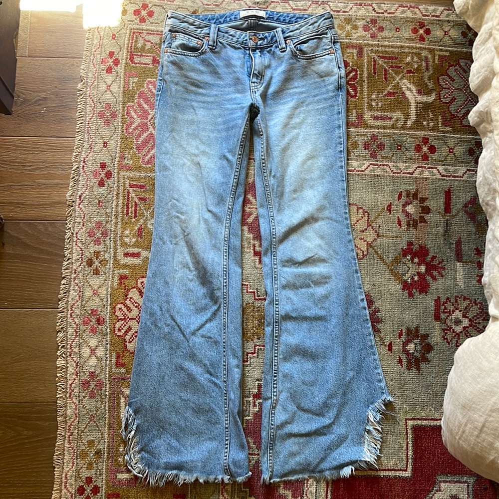 FREE PEOPLE shark bite, low rise jeans.